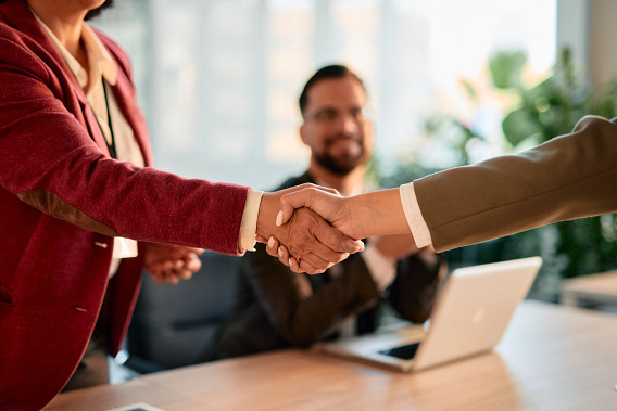 Close Up Shoot of Businesswomen shaking hands after successful meeting in the office stock photo